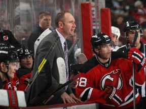 New Jersey Devils GM Lou Lamorello says head coach Peter DeBoer will be back with the Devils next season. (AFP)