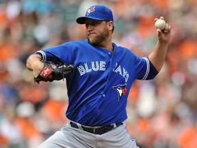 Toronto Blue Jays starting pitcher Mark Buehrle (56) throws the ball in the first inning against the Baltimore Orioles at Oriole Park at Camden Yards. (Joy R. Absalon-USA TODAY Sports)
