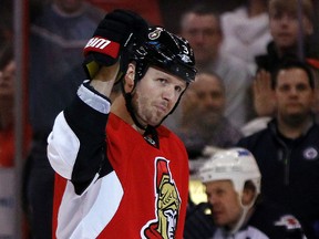 Ottawa Senators' Marc Methot (3) celebrates his assist on Zack Smith's (15)goal against the Winnipeg Jets in the third period during NHL action in Ottawa, Ont. on Thursday January 2, 2014. The Senators won 4-3. Darren Brown/Ottawa Sun/QMI Agency