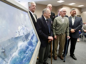 Mayor of Quinte West, Ont. John Williams, left, and historian Roger Litwiller, right, pose with a group of veterans along a painting of the corvette HMC Trentonian as Litwiller launches his second book, 'White Ensign Flying' at Quinte West city hall in Trenton, Ont. Saturday, April 12, 2014.   - Jerome Lessard/The Intelligencer/QMI Agency