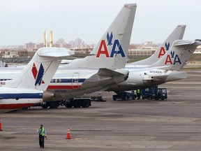 American Airlines aircraft sit on the tarmac at LaGuardia airport in New York in this April 16, 2013 file photo.  (REUTERS/Carlo Allegri)