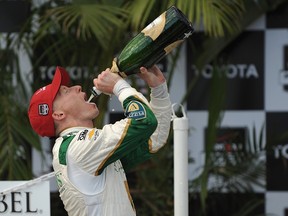 Mike Conway of England, driver of the #20 Ed Carpenter Racing Dallara Chevrolet, celebrates after winning the Verizon IndyCar Series Toyota Grand Prix of Long Beach on April 13, 2014 on the streets of Long Beach, California. (JONATHAN MOORE/Getty Images/AFP)