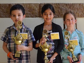 Nicholas Benavides (left) finished first in the Kingston Region Spelling Bee primary speller competition followed by Meem Zulkermine and Sarah Stephenson