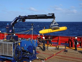 The Bluefin 21, the Artemis autonomous underwater vehicle (AUV), is hoisted back on board the Australian Defence Vessel Ocean Shield after a successful buoyancy test in the southern Indian Ocean as part of the continuing search for the missing Malaysian Airlines flight MH370 in this picture released by the U.S. Navy April 4, 2014. (REUTERS/U.S. Navy photo by Mass Communication Specialist 1st Class Peter D. Blair/Handout)