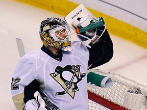 Pittsburgh Penguins goalie Tomas Vokoun drinks after giving up a goal to the Boston Bruins during the first period in Game 3 of their NHL Eastern Conference finals hockey playoff series in Boston, Massachusetts, June 5, 2013. (REUTERS)