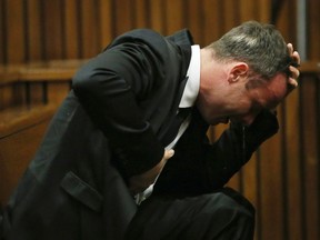 Oscar Pistorius becomes emotional during his trial at the high court in Pretoria April 7, 2014. (REUTERS)