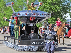 Wayne Pedersen, sitting in the USS Vulcan float's saucer in this file photo, is hoping to find people interested in forming up a group to take the float to other communities' parades. While he already has plans to attend a few parades, Pedersen says he can't attend them all.
