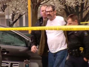 Frazier Glenn Cross, 73, of Aurora, Missouri, is led to a police car after his arrest following shooting incidents which killed three people at two Jewish centers on Sunday in Overland Park, south of Kansas City, Kansas in a still image from video April 13, 2014. Cross, also known as Frazier Glenn Miller, is expected to face federal hate crimes charges as well as state charges, authorities said on Monday. Video taken April 13, 2014.  REUTERS/KCTV5/Handout via Reuters