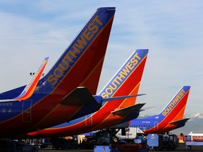 Southwest Airlines jets wait on the tarmac at Denver International Airport in Denver January 22, 2014. (REUTERS/Rick Wilking)