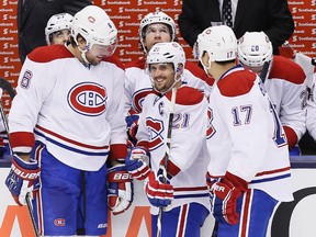 Montreal Canadiens defenceman Douglas Murray (6), captain Brian Gionta (21) and forward Rene Bourque (17) react during a break in the action against the Toronto Maple Leafs at the Air Canada Centre. (John E. Sokolowski/USA TODAY Sports)