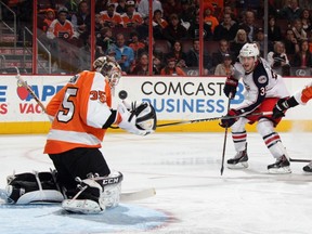 Steve Mason of the Philadelphia Flyers makes the third period save on Boone Jenner of the Columbus Blue Jackets at the Wells Fargo Center on April 3, 2014 in Philadelphia, Pennsylvania. (Bruce Bennett/Getty Images/AFP)