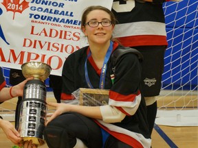 St. Thomas native Emma Reinke holds the Canadian Junior Goalball Ladies Division championship trophy after winning the title Sunday in Brantford. (Submitted photo)