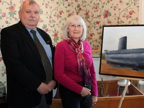 Ian Raven, Elgin Military Museum, accepts HMCS Ojibwa painting from Oshawa artist Eileen Myers. She undertook the painting at the urging of her husband, Alan Smith, who served on the British Royal Navy Oberon class sub, HMS Otter. (Contributed)