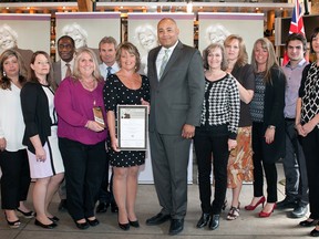 Sheri Houston, centre, receives June Rose Callwood volunteerism award for Tara "Boom" Houston Children's Foundation from Ontario Minster of Citizenship and Immigration Michael Coteau. Joining Houston are foundation directors Jackie Robitaille, left, Kelly Bender, Deputy Citizenship and Immigration Minister Chisanga Puta-Chekwe, Paula Chatterson, Scott Houston, along with Cathy Girard, Cathy Hamilton, Alisa Devries, Josh Houston, Heather Weitzel. Absent: Stacey Farr.
Ministry of Citizenship and Immigration