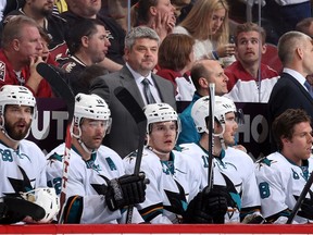 Head coach Todd McLellan of the San Jose Sharks watches from the bench during the NHL game against the Phoenix Coyotes at Jobing.com Arena on April 12, 2014 in Glendale, Arizona. (Christian Petersen/Getty Images/AFP)