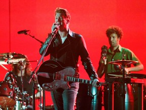 Josh Homme of Queens of the Stone Age performs "My God Is the Sun" at the 56th annual Grammy Awards in Los Angeles, California January 26, 2014.  (REUTERS/ Mario Anzuoni )