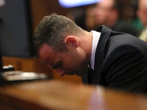 Oscar Pistorius reacts during his murder trial in Pretoria on Tuesday, April 15, 2014. (Siphiwe Sibeko/Reuters)