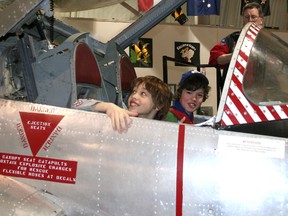 Isaac Hewitt-Gatt (left) and  Ryan VanDenNieuwenhuizen (right). Plane: Canadair CT-114 Tutor.