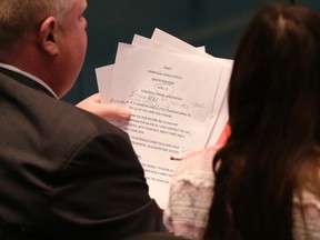 Mayor Rob Ford works on his campaign launch speech  with staff in council chambers on April 3. (CRAIG ROBERTSON/Toronto Sun)