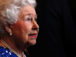 Britain's Queen Elizabeth attends a Northern Ireland-themed reception at Windsor Castle at Windsor in southern England April 10, 2014. (REUTERS/Luke MacGregor)