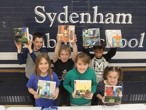 Students from Sydenham Public School on Tuesday, holding up their artwork which will be sold Wednesday at a show and sale include: front row from left, Lydia Morrow, Lily Rich, Brigid Green; back row, Cole Cressler, Danny Thornhill and Liam Kuzma-Hunt. 
MICHAEL LEA\THE WHIG STANDARD\QMI AGENCY