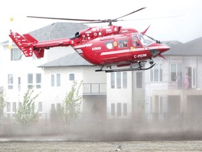 The air ambulance lands behind a home at 32 Cypress Ridge, the grand prize in the 2013 STARS Manitoba Lottery. (Winnipeg Sun files)