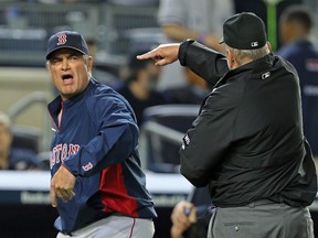 Boston Red Sox manager John Farrell is thrown out of the game by umpire Bob Davidson against the New York Yankees at Yankee Stadium in New York, April 13, 2014. (ADAM HUNGER/USA Today)