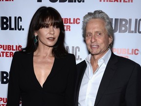 Actors Catherine Zeta-Jones and Michael Douglas attend "The Library" opening night celebration at The Public Theater on April 15, 2014 in New York City.  Dimitrios Kambouris/Getty Images/AFP