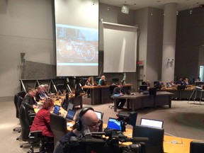 Members of Ottawa's Transit Commission discuss whether to have OC Transpo buses stop at all rail crossings during its meeting at City Hall Wednesday, March 16, 2014. (TONY CALDWELL Ottawa Sun)