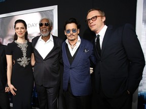 Cast members Rebecca Hall, Morgan Freeman, second from left, Johnny Depp and Paul Bettany, right, pose at the premiere of "Transcendence" in Los Angeles, California April 10, 2014. (REUTERS/Mario Anzuoni)