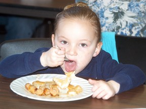 Adilyn Haggith, 4, of Wallaceburg, enjoys a pancake breakfast at the Port Lambton Community Centre on April 12. The breakfast was a fundraiser for the Brander Park Splah Pad. The splash pad committee is working on raising $100,000 and so far as raised $65,000. St. Clair Township will contribute $100,000 towards the splash pad. The committee hopes to break ground on the splash pad in August of this year.