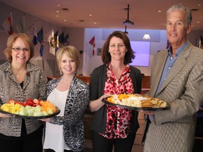 Healthy food, including fruits and vegetables, are offered to 6,700 school children in Lambton County through student nutrition programs. Those programs got a $10,000 boost Wednesday thanks to the Noelle's Gift Foundation. Pictured with some healthy snacks at the County of Lambton administration building are foundation committee members Kevin Cannon and Sue Serratore, left, Lana Smith, chairperson of the Lambton Student Nutrition Advisory Committee, and Leslie Palimaka, student nutrition coordinator with Lambton Public Health. (TYLER KULA, The Observer)