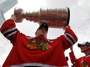 Jonathan Toews holds up the Stanley Cup trophy during the Chicago Blackhawks Stanley Cup victory parade and rally in June 2010. (Jonathan Daniel/Getty Images/AFP)