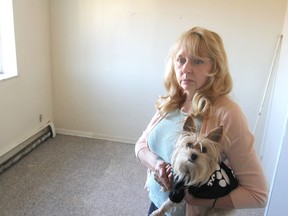 Marlene Mundell stands in the water-damaged bedroom of her apartment in Kingston. Recently she received an eviction notice from the landlord.
MICHAEL LEA\THE WHIG STANDARD\QMI AGENCY