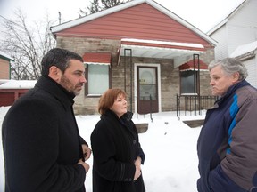 George McNeish, head of the Fugitive Slave Chapel Preservation Project, right, tours the building with local MP Irene Mathyssen and heritage critic Pierre Nantel. A sod-turning is set for May 17.  (Free Press file photo)