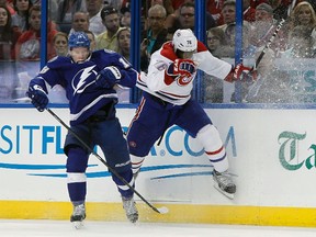 Tampa Bay Lightning left wing Ondrej Palat checks Montreal Canadiens defenceman P.K. Subban into the boards during the second period in Game 1 at Tampa Bay Times Forum. (Kim Klement/USA TODAY Sports)