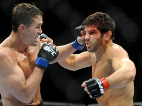Canadian Patrick Cote (right) fights Kyle Noke of Australia in the TUF: Nations finale Wednesday, April 16, 2014 in Quebec City. (SIMON CLARK/QMI Agency)