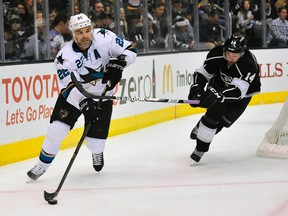 San Jose Sharks defenceman Dan Boyle (22) moves the puck against Los Angeles Kings right wing Justin Williams (14) during the first period at Staples Center earlier this season (Gary A. Vasquez-USA TODAY Sports)