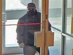 Ottawa cops are seeking this man in connection with a bank and customer robbery on April 16 along the 500 block of Somerset St. West. (Submitted image)