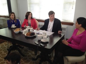 John Tory speaks to Marsha Seca, Maria Papadopoulos and Nicole Lippa about gridlock in Toronto on Thursday. (DON PEAT/Toronto Sun)