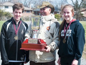 Three-time champion Jim Green is flanked by 2014 winners Liam Garvin of NCC and Isabella Goneau of MSS after the 59th running of the Ken and Cleo Colling Memorial Road Race this week at Moira. (ZACHARY SHUNOCK for The Intelligencer)