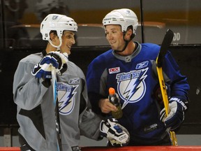 Vincent Lecavalier (left) and Martin St. Louis, seen here in 2010 during their time with the Lightning, will face each other as the Flyers take on the Rangers during the first round of the 2014 NHL playoffs. (QMI Agency/Files)