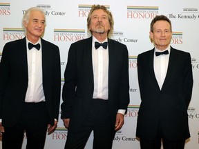 Jimmy Page, Robert Plant and John Paul Jones are seen in this December 1, 2012, file photo.  Led Zeppelin is reissuing its first three studio albums June 3rd.  REUTERS/Mike Theiler