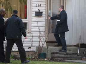 Royal Canadian Mounted Police investigators canvas the London neighbourhood around the home of Stephen Solis-Reyes, who has been charged in connection with exploiting the "Heartbleed" bug to steal taxpayer data from a government website, on April 16. The suspect was arrested at his home in London, Ontario on Wednesday and faces criminal charges of unauthorized use of computer and mischief in relation to data.  REUTERS/Geoff Robins