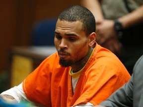 R&B singer Chris Brown, who pleaded guilty to assaulting his girlfriend Rihanna, appears in court for allegedly violating his probation, in Los Angeles, California, March 17, 2014. (REUTERS/Lucy Nicholson)
