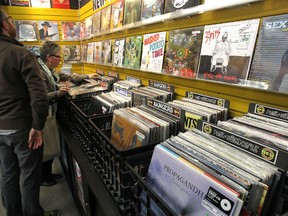 Customers shop vinyl at Music Trader on Osborne Street in Winnipeg, Man., on Thu., April 17, 2014. (Kevin King/Winnipeg Sun)