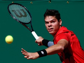 Milos Raonic returns the ball to Tommy Robredo during the Monte Carlo Masters in Monaco on Thursday, April 17, 2014. (Eric Gaillard/Reuters)