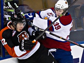 Edmonton's Brett Pollock hits Medicine Hat's Kyle Becker during a  February game at Rexall Place. (Codie McLachlan, Edmonton Sun)