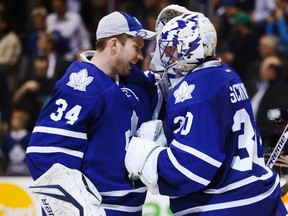 Toronto Maple Leafs goalies James Reimer and Ben Scrivens (right) celebrate after a win over the Florida Panthers in Toronto March 26, 2013. (REUTERS/Mark Blinch)