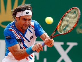 David Ferrer of Spain returns the ball to his compatriot Rafael Nadal during their quarter-final match at the Monte Carlo Masters in Monaco April 18, 2014. REUTERS/Eric Gaillard